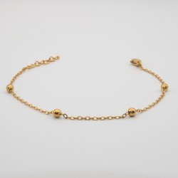4 gouden bolletje aan een fijn schakel armbandje