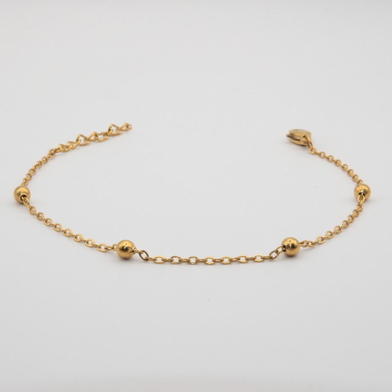 4 gouden bolletje aan een fijn schakel armbandje 4 gouden bolletje aan een fijn schakel armbandje