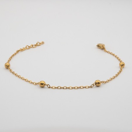 4 gouden bolletje aan een fijn schakel armbandje