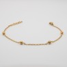 4 gouden bolletje aan een fijn schakel armbandje