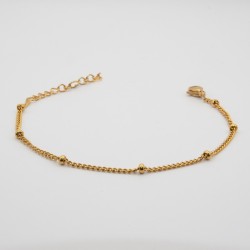 gouden bolletjes aan een schakel armbandje